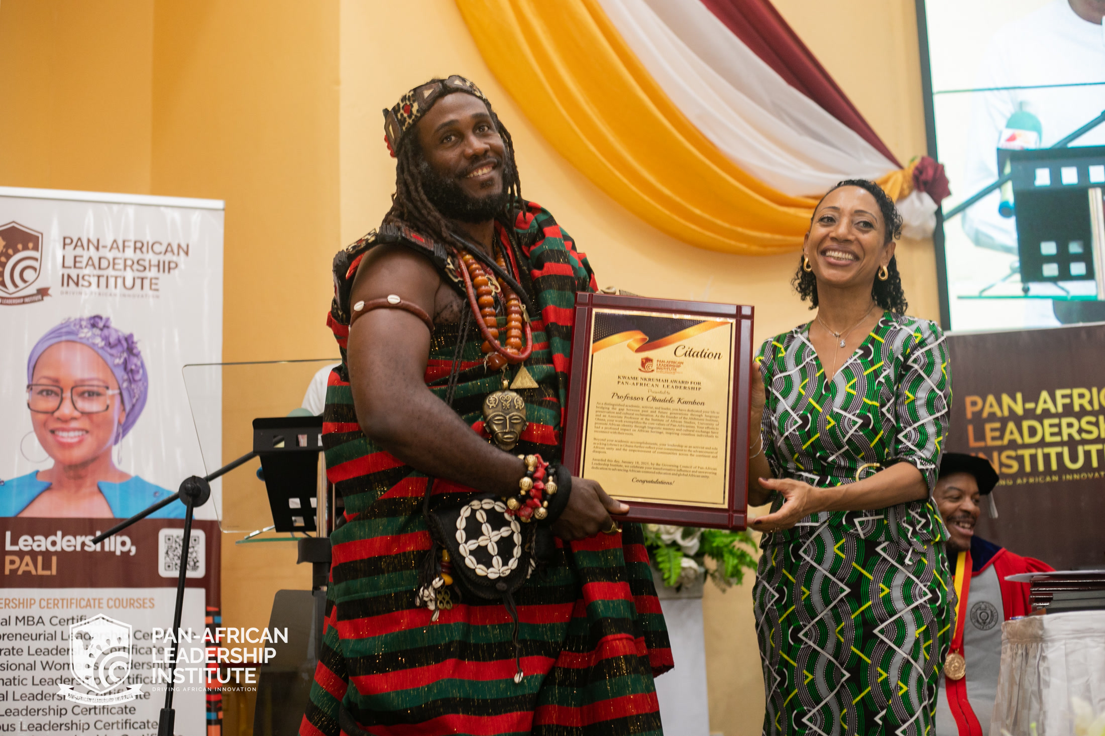 Ɔbenfo Ọbádélé Kambon with Samia Nkrumah at the Kwame Nkrumah Award for Pan-African Leadership presentation